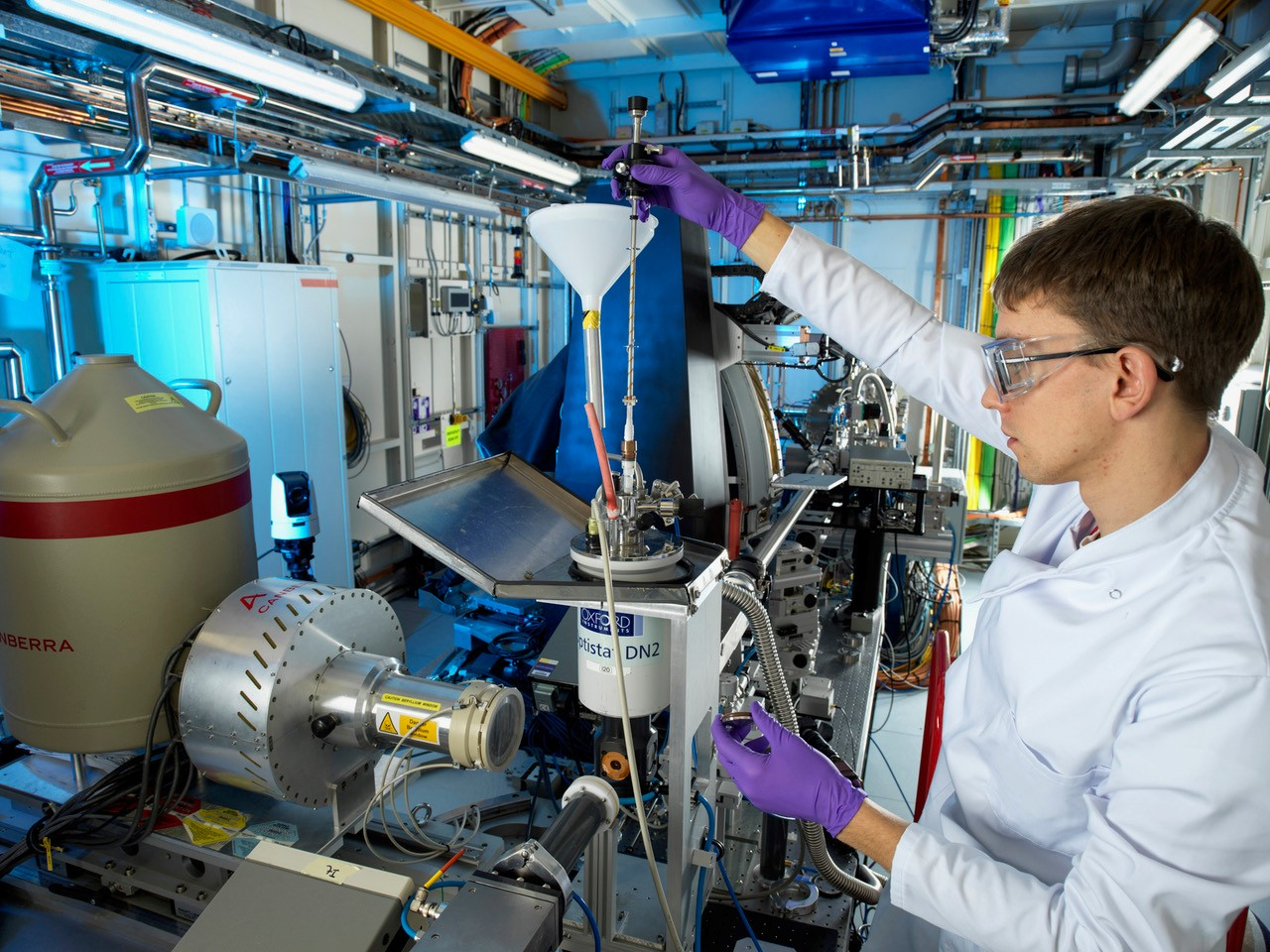 Researcher loading sample onto beamline