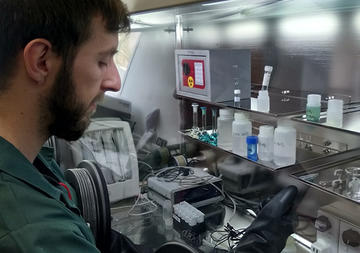 Researcher at work in lab Researcher at work in lab